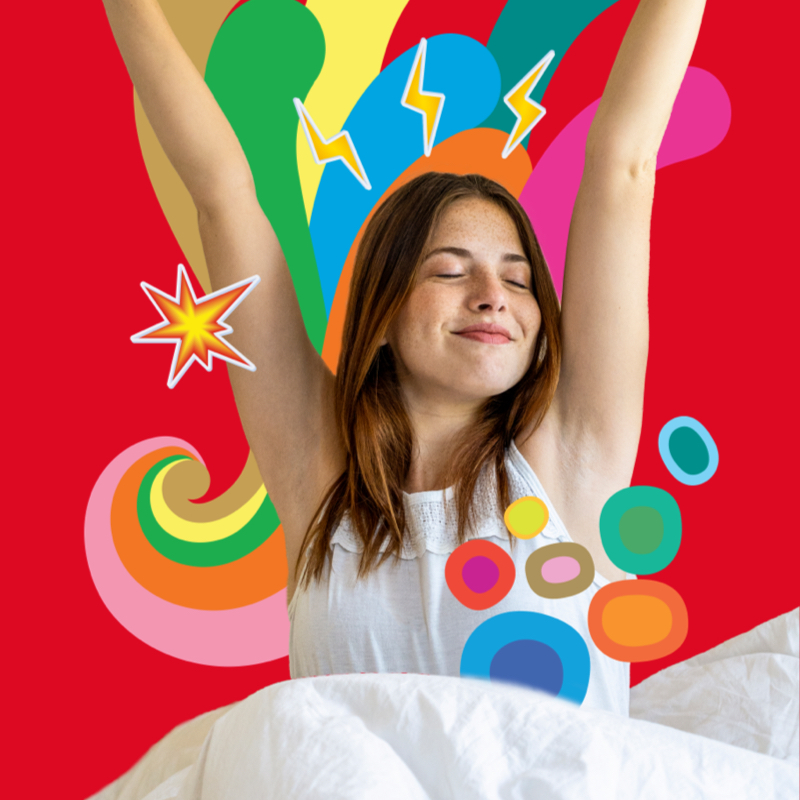 Woman stretching in bed after a good nights sleep