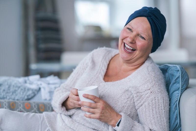 close up of a smiling chemo patient